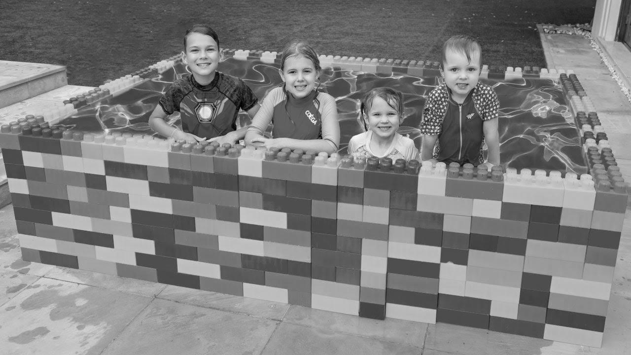 Five Children The way to Swim within the Kids Pool and Performs with Enjoyable Water Toys