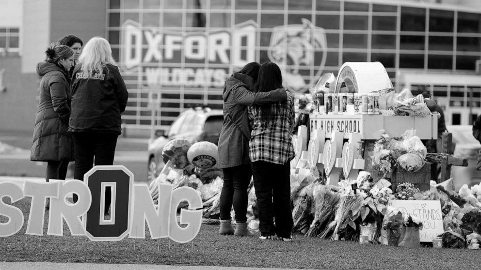 Victims, dad and mom of Oxford college capturing victims sue faculty workers